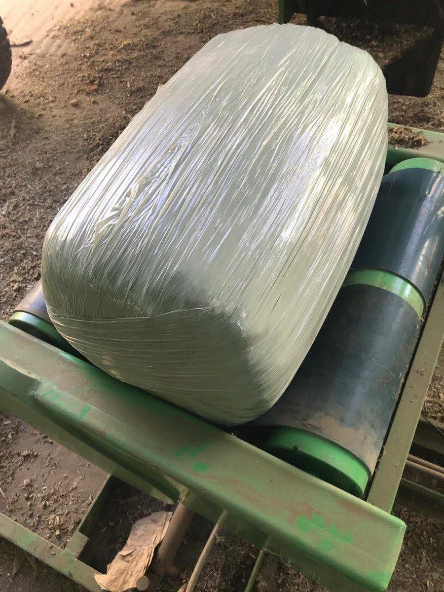 Baling and wrapping in progress
